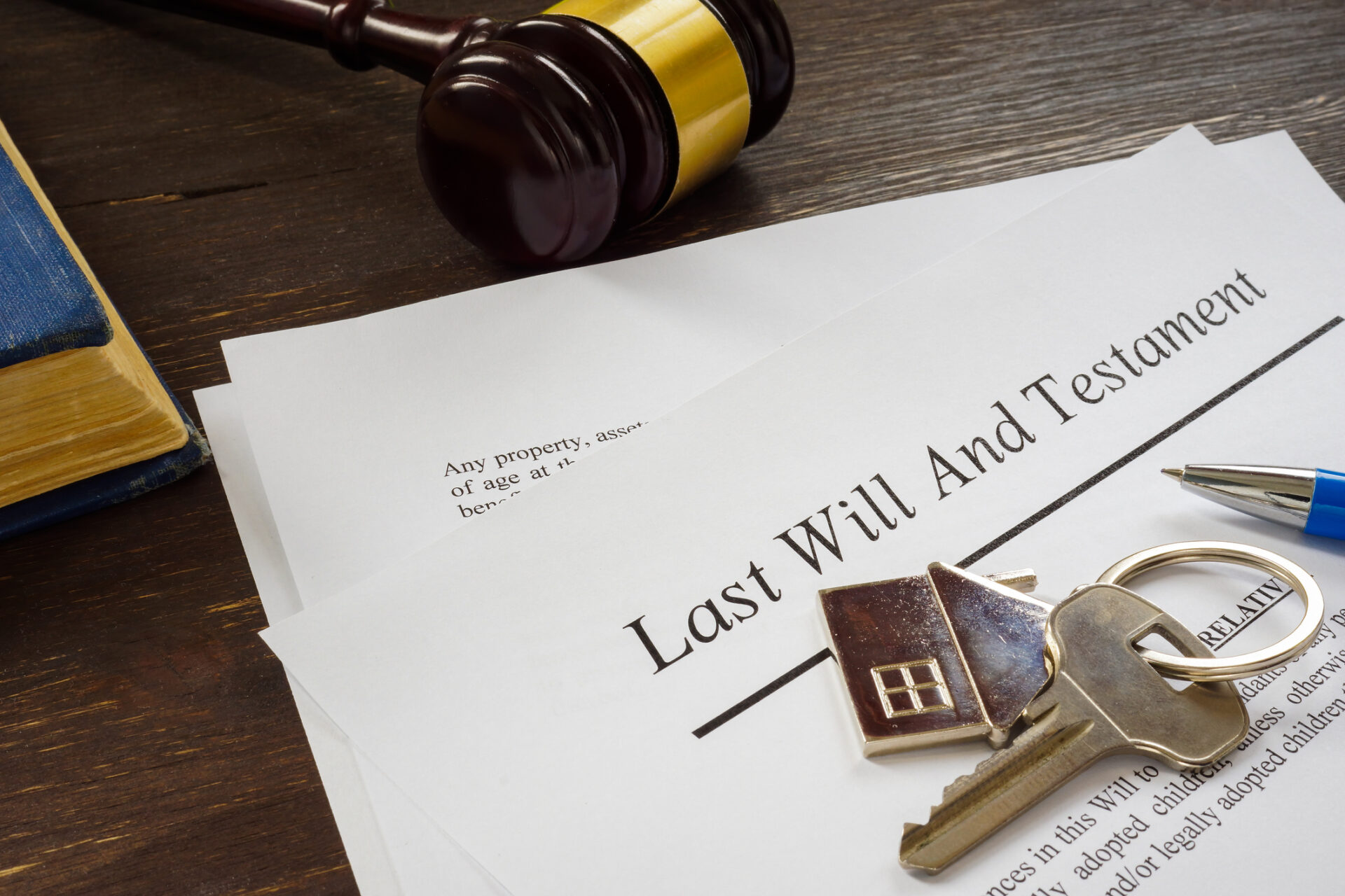 Last will and testament papers and key as symbol of property.