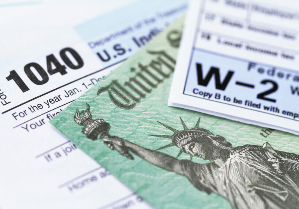 IRS tax forms with tax refund check