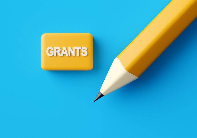 Pencil and an eraser with the word Grants. Education grants, scholarship and schooling concept.